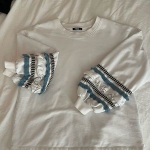 Fringe sleeve sweatshirt